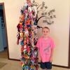 Will Baird posing with the thousands of origami cranes to wish Susan health and happiness